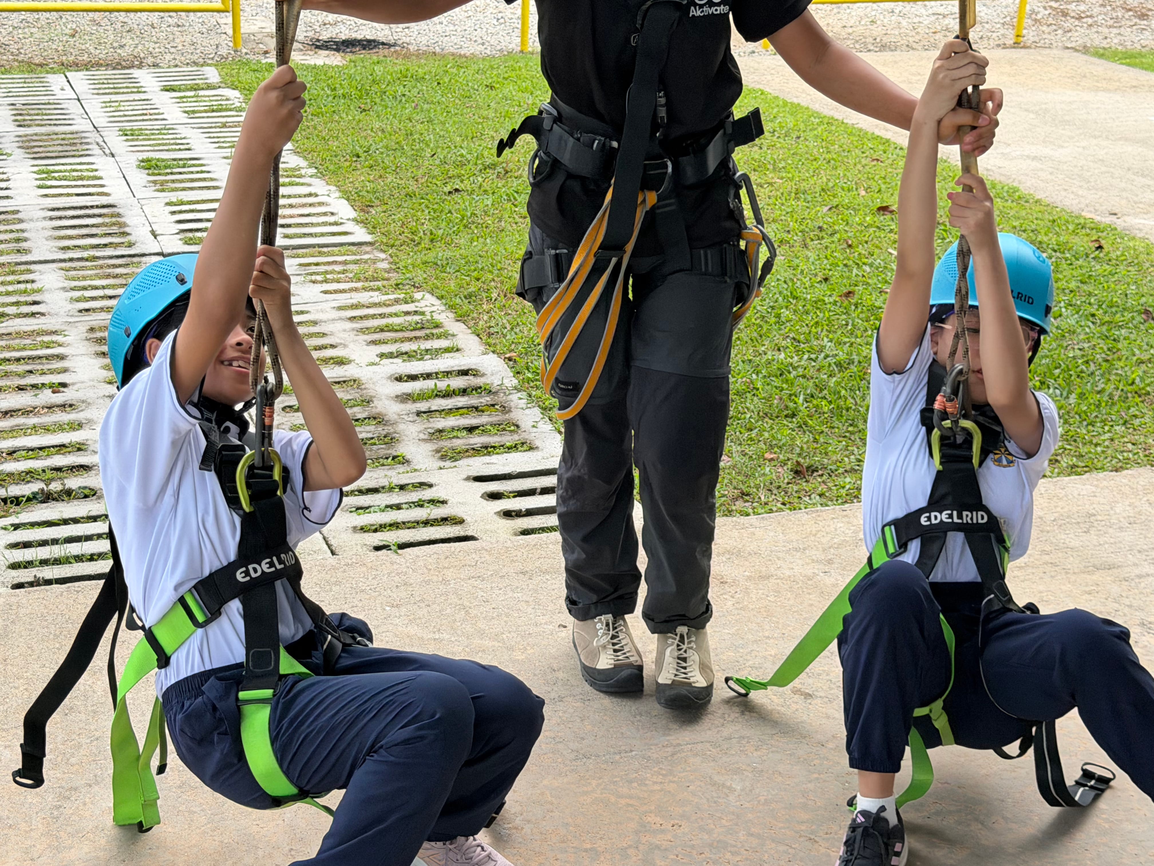 All geared up for the next challenge, with an instructor on hand to check every harness and clip.